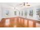 Spacious living room featuring hardwood floors, large windows and lots of light at 4446 Frontier Way, Sugar Hill, GA 30518