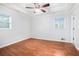 Bright main bedroom with tray ceiling and a ceiling fan at 4446 Frontier Way, Sugar Hill, GA 30518