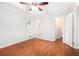 Spacious main bedroom featuring ceiling fan and attached ensuite at 4446 Frontier Way, Sugar Hill, GA 30518