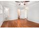 Bright main bedroom with hardwood floors, tray ceiling, ensuite and closet at 4446 Frontier Way, Sugar Hill, GA 30518