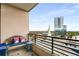 Relaxing balcony with comfortable seating, offering a serene space to enjoy the city views and clear blue sky at 750 Park Ne Ave # 14Se, Atlanta, GA 30326