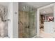 Modern bathroom with glass-enclosed shower, walk-in closet, and neutral tones at 750 Park Ne Ave # 14Se, Atlanta, GA 30326