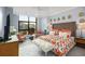 Bright bedroom showcasing a large window with city views, creating a serene and inviting atmosphere at 750 Park Ne Ave # 14Se, Atlanta, GA 30326
