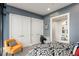 Comfortable bedroom featuring neutral walls, black and white bedding, and a small workspace at 750 Park Ne Ave # 14Se, Atlanta, GA 30326
