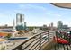 Scenic balcony view showcasing neighboring buildings, local architecture, clear skies, and outdoor seating at 750 Park Ne Ave # 14Se, Atlanta, GA 30326