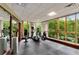 Modern gym featuring cardio machines and free weights with floor to ceiling nature views at 750 Park Ne Ave # 14Se, Atlanta, GA 30326