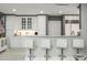 An inviting kitchen with white cabinets, marble countertops, and seating at the breakfast bar at 750 Park Ne Ave # 14Se, Atlanta, GA 30326