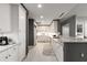 A well-lit kitchen with white cabinets, marble countertops, and modern appliances at 750 Park Ne Ave # 14Se, Atlanta, GA 30326