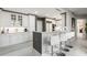 A sleek, modern kitchen featuring white cabinets, marble countertops, and bar seating at 750 Park Ne Ave # 14Se, Atlanta, GA 30326
