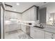 A modern kitchen featuring white cabinets, stainless steel appliances, and marble countertops at 750 Park Ne Ave # 14Se, Atlanta, GA 30326