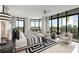 Luxurious main bedroom with floor-to-ceiling windows offering scenic views and elegant furnishings at 750 Park Ne Ave # 14Se, Atlanta, GA 30326