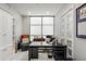 Well-lit home office with modern desk, built-in shelving, and comfortable seating at 750 Park Ne Ave # 14Se, Atlanta, GA 30326