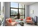 Cozy sitting area near a large window, perfect for relaxing and enjoying panoramic views of the cityscape at 750 Park Ne Ave # 14Se, Atlanta, GA 30326