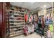 Organized walk-in closet featuring extensive shoe racks and clothing storage, maximizing space and convenience at 750 Park Ne Ave # 14Se, Atlanta, GA 30326