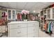Spacious walk-in closet with custom shelving and a center island, providing ample storage for clothes and accessories at 750 Park Ne Ave # 14Se, Atlanta, GA 30326