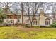 Expansive backyard featuring a patio area, lush greenery, and serene outdoor space at 192 Maple Wood Dr, Lawrenceville, GA 30046