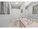 Bright bathroom with a neutral color scheme, large sink and shower combo at 192 Maple Wood Dr, Lawrenceville, GA 30046