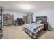 Spacious bedroom with a decorative bed, gaming setup and natural light, perfect for relaxation and entertainment at 192 Maple Wood Dr, Lawrenceville, GA 30046