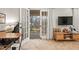Bedroom features French doors leading to a porch, plush carpet, and contemporary decor, creating a bright and inviting space at 192 Maple Wood Dr, Lawrenceville, GA 30046