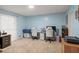 Bright bedroom with light blue walls, two desks, and comfortable work-from-home space, great for students at 192 Maple Wood Dr, Lawrenceville, GA 30046
