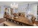 Elegant dining room with a chandelier and a fireplace at 192 Maple Wood Dr, Lawrenceville, GA 30046