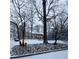 Two-story home in winter, showing snow-covered front yard and surrounding trees at 192 Maple Wood Dr, Lawrenceville, GA 30046