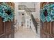 Elegant foyer featuring a staircase and ornate iron railings at 192 Maple Wood Dr, Lawrenceville, GA 30046