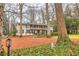 Beautiful home featuring a well-kept lawn, mature trees, and a classic facade at 192 Maple Wood Dr, Lawrenceville, GA 30046