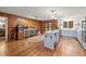 Spacious kitchen features wood paneling, an island, stainless steel appliances, and hardwood flooring at 192 Maple Wood Dr, Lawrenceville, GA 30046