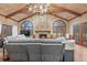 Open living room featuring a stone fireplace, vaulted ceilings, and large windows at 192 Maple Wood Dr, Lawrenceville, GA 30046
