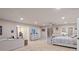 Serene main bedroom offering a seating area and backyard access at 192 Maple Wood Dr, Lawrenceville, GA 30046