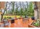 Brick patio equipped with outdoor seating, a fire pit, a grill, and a decorative spiral staircase, perfect for gatherings at 192 Maple Wood Dr, Lawrenceville, GA 30046