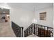Elegant staircase with wrought iron railing and chandelier, leading to the upper level at 192 Maple Wood Dr, Lawrenceville, GA 30046