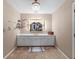 Classic vanity room with a mirrored vanity and chandelier, featuring neutral color tones at 192 Maple Wood Dr, Lawrenceville, GA 30046