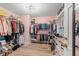 Spacious walk-in closet with custom shelving and hanging racks for optimal organization and storage at 192 Maple Wood Dr, Lawrenceville, GA 30046