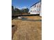 Backyard featuring stone firepit and seating area at 135 Henley St, Canton, GA 30114