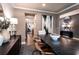 This dining room features contemporary decor with a dark wood table, stylish chairs, and modern artwork at 135 Henley St, Canton, GA 30114