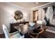 Elegant dining room showcasing modern decor with a dark wood table, stylish chairs, and contemporary artwork at 135 Henley St, Canton, GA 30114