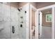 Modern shower with marble tile and sleek black fixtures at 135 Henley St, Canton, GA 30114