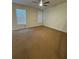 Spacious bedroom with carpeted floors and natural lighting at 1696 Tailmore Ln, Lawrenceville, GA 30043