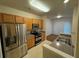 Kitchen with stainless steel appliances, wood cabinets, and sink at 1696 Tailmore Ln, Lawrenceville, GA 30043