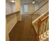 Living room view with stairway and carpeted floors at 1696 Tailmore Ln, Lawrenceville, GA 30043