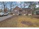 Pleasant home featuring a wood facade, a lovely front porch, and a well-manicured lawn at 2024 Collier W Cir, Decatur, GA 30032