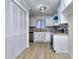 Kitchen featuring all white cabinets, granite countertops, and a stainless steel dishwasher at 2370 Old Mill Sw Dr, Conyers, GA 30094