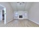 Bright living room with vaulted ceilings, a stone fireplace, wood-look floors, and a ceiling fan at 2370 Old Mill Sw Dr, Conyers, GA 30094