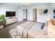 Spacious main bedroom with a queen bed, soft carpet, and a double door closet at 180 Fieldview Ln, Covington, GA 30016