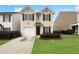 Charming two-story home with a well-maintained front yard and a one car garage at 180 Fieldview Ln, Covington, GA 30016