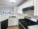 Clean kitchen with white cabinets, stainless steel appliances, and a breakfast bar at 180 Fieldview Ln, Covington, GA 30016