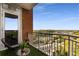 Balcony with city view, black egg chair, small round table, and artificial turf at 1820 Peachtree Nw St # 1215, Atlanta, GA 30309