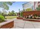 Beautiful courtyard with manicured lawn, brick accents, water feature, and view of neighboring building at 1820 Peachtree Nw St # 1215, Atlanta, GA 30309